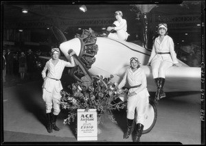Girls on ship at booth in Aero Exposition at Mines Field