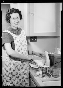 Mrs. Roscoe Turner baking with Formay, Southern California, 1935