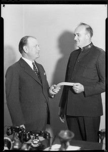 Mr. Metzger presenting check to doctor, Southern California, 1933