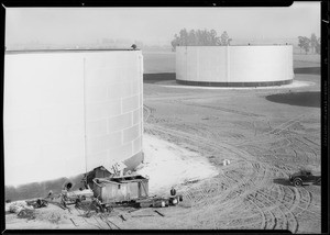 Cleaning oil storage tanks, Santa Fe Springs, CA, 1930