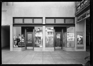 Signs etc. in store windows, Wilshire theatre building, Southern California, 1931