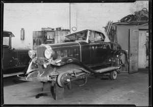 Wrecked Chevrolet coupe, Southern California, 1933