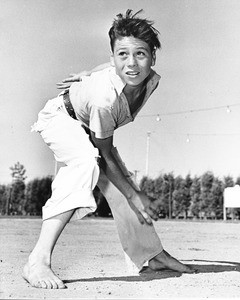 A young karate student practices his moves in the comforts of a Los Angeles park