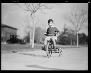 Boy on tricycle, The May Company, Southern California, 1931