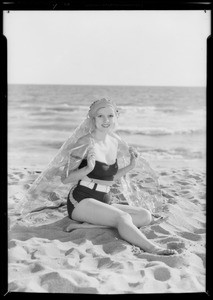 Cellophane blanket on bathing girl, Southern California, 1932