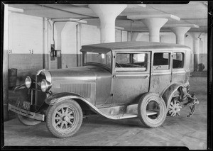 Wrecked Oldsmobile coupe and sedan belonging to Mrs. Olive Cardinet at Elite Garage, Southern California, 1931