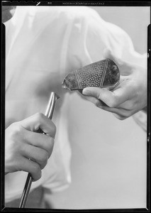 Shrunk shirt, broken golf club, chair burst out, May Co., Southern California, 1933