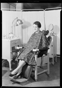 Girl wearing apron in beauty parlor, Southern California, 1931