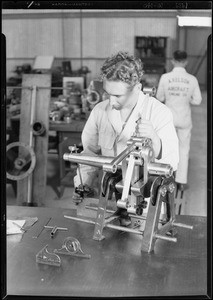 Packing motor into box, tool kit, man working on crankshaft, Southern California, 1929