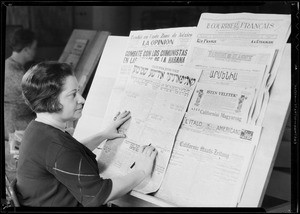 Woman reading foreign papers, Southern California, 1932