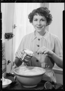 Muriel Kirkland cooking with Formay, Southern California, 1934