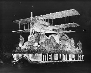 Shriner's night time parade at the Coliseum, featuring Paramount Picture's' "Men with Wings" float