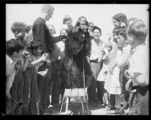 Boys and animal pets at playground, Southern California, 1931