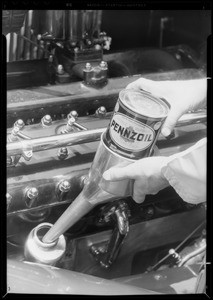 Filling Lincoln from quart can, Pennzoil, Southern California, 1933