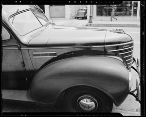 Mark on fender of 1935 Plymouth owned by Kelly Springfield Tire Company, 1127 South Olive Street, Los Angeles, CA, 1940