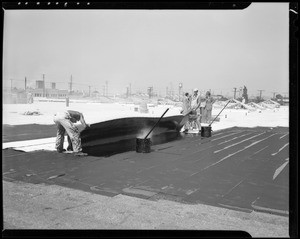 Applying roofing, Safeway meat warehouse, Southern California, 1940