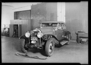 Wrecked Buick in Howard Automobile Co. garage, Southern California, 1930