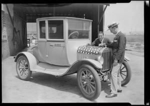 Playing checkers on car, Southern California, 1924