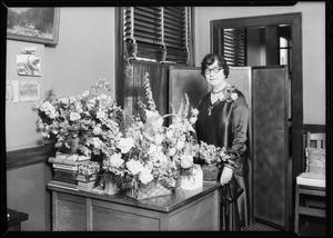 Mrs. Dolly Reed & flowers, Southern California, 1930