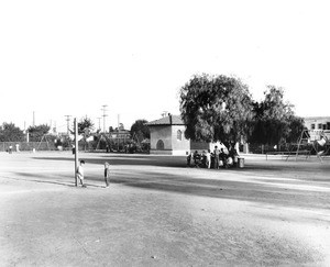 A few people gather at one of Los Angeles' many playgrounds