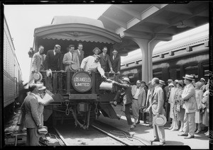 Burroughs adding machine, men leaving on train, Charles Bird, Southern California, 1926