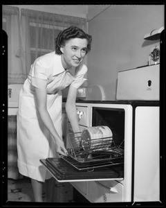 Oven rack with Miss Kitchner, Los Angeles, CA, 1940