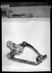 Broken knee action parts from Oldsmobile, Royal Indemnity, Southern California, 1934
