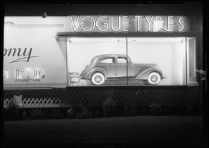 Vogue Tyre board with Hupmobile sedan, Southern California, 1935