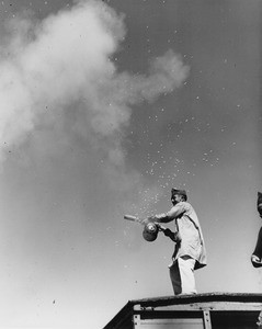 American Legion parade, Long Beach, man on roof