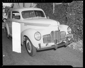 Studebaker sedan showing damage to right front, 1913 Oxley Street, South Pasadena, CA, 1940