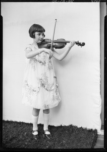 Girl playing violin, Broadway Department Store, Southern California, 1925