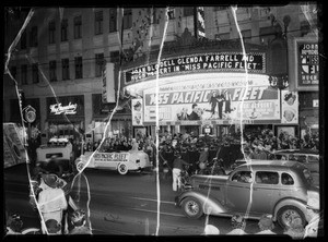 Parade of navy men in front of Warners Theater, Los Angeles, CA, 1935