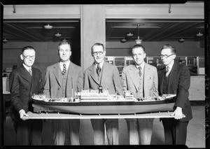 Group of men and model ship, foreign trade week, Southern California, 1928