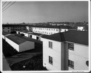 Wyvernwood Housing complex with 2-story units divided by greenbelt and walkways