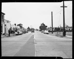 Parked car and intersection of 8th Avenue and Hyde Park Boulevard, Los Angeles, CA, 1940