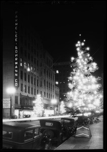 Christmas tree at night in street, South Flower Street, Los Angeles, CA, 1928