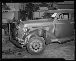 Wrecked Plymouth sedan, Bell Auto Works, 1633 South Hope Street, Los Angeles, CA, 1940