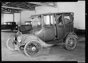 Ford sedan at Globe garage belonging to J. Granada, Southern California, 1930