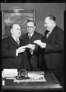 Mayor Shaw receiving tickets for charity football team, Southern California, 1934