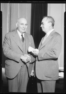 Governor Merriam receiving tickets to "A Midsummer Night's Dream," Southern California, 1934