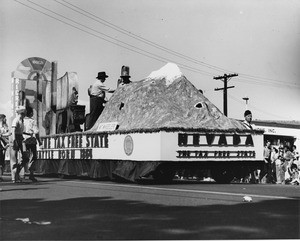 American Legion parade, Long Beach, float from Nevada, "The Tax Free State," featuring Mount Wheeler and Nevada's ranching and mining industries