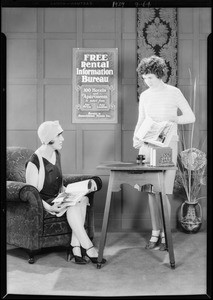 Showing photographs to client, Southern California, 1929