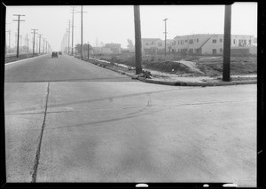 Intersection of South Cochran Avenue and San Vicente Boulevard and cars, Southern California, 1933