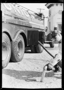 New "Leader" banner and big truck at service station for bulletin cover, Southern California, 1932