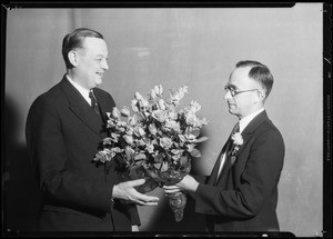 Presenting roses to president & autographing smock, Southern California, 1932