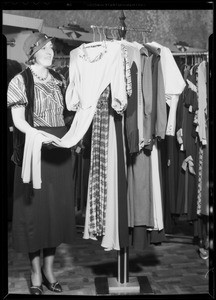 Customer shopping for dresses, Southern California, 1934