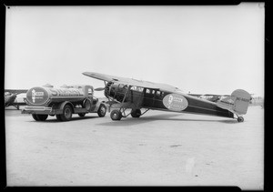 Plane and truck at Municipal Airport