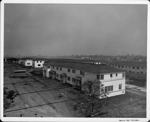 Wyvernwood Housing with 2-story units divided by greenbelt and walkways under construction