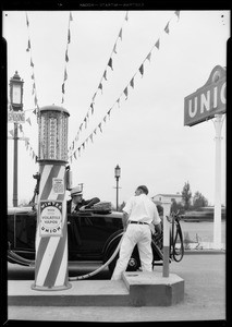 Filling car with 'Volatile Vapor', streamers from pump to sky, Southern California, 1931