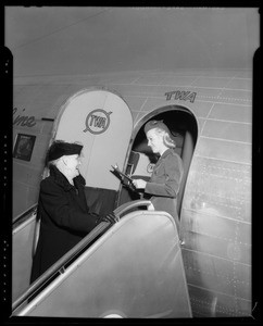 Mrs. V.G. Ryker boarding TWA plane, Burbank, CA, 1940